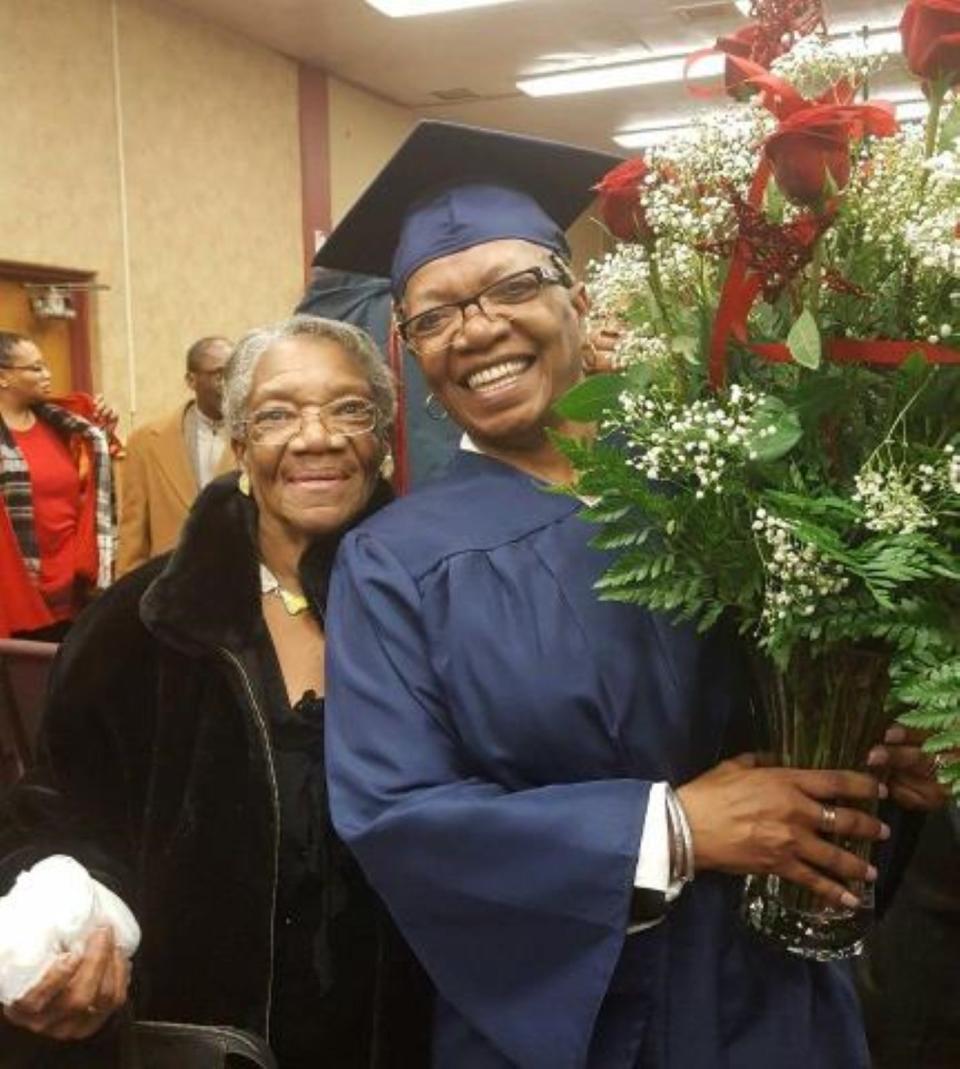 Cordelia Taylor, founder of Family House, a residential facility for seniors to live with dignity and respect, is shown with one of her eight children, Dinah Taylor, during her master's ceremony.