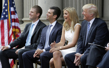 FILE PHOTO: (L-R) Eric Trump, Donald Trump Jr., and Ivanka Trump and Donald Trump attend the ground breaking of the Trump International Hotel at the Old Post Office Building in Washington July 23, 2014. REUTERS/Gary Cameron