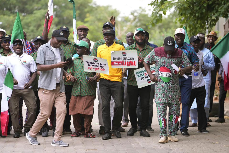 People protest against the recent increase in the electricity tariff, in Abuja Nigeria, Monday, May 13, 2024. Labor unions in Nigeria staged nationwide have protested a recent increase in electricity prices introduced after the removal of subsidies by the West African nation’s government. (AP Photo/Sunday Alamba)