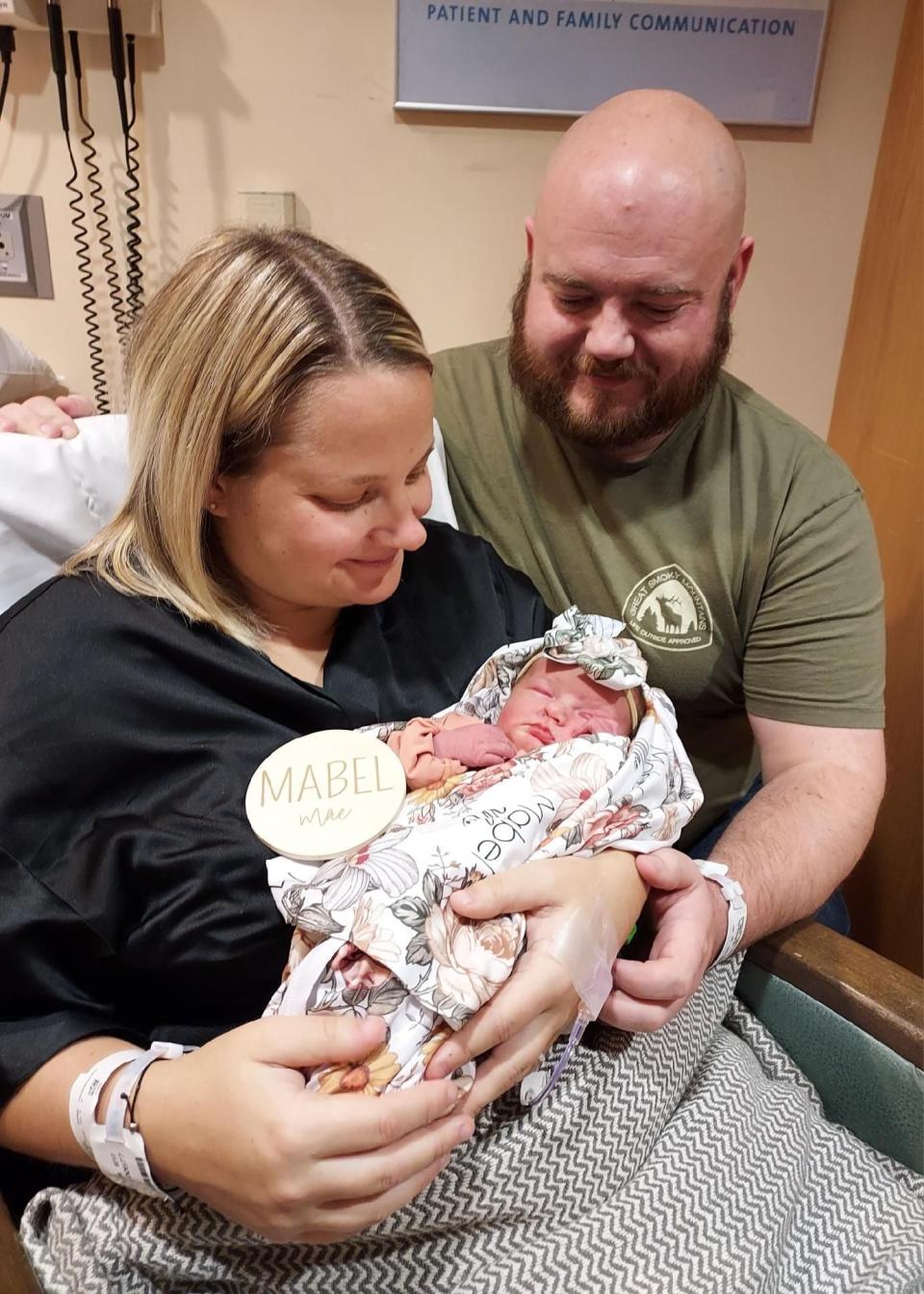 Kirstyn and Brad Stapleton, of Troy, and their daughter Mable Mae. Mable was the first baby born for Premier Health.