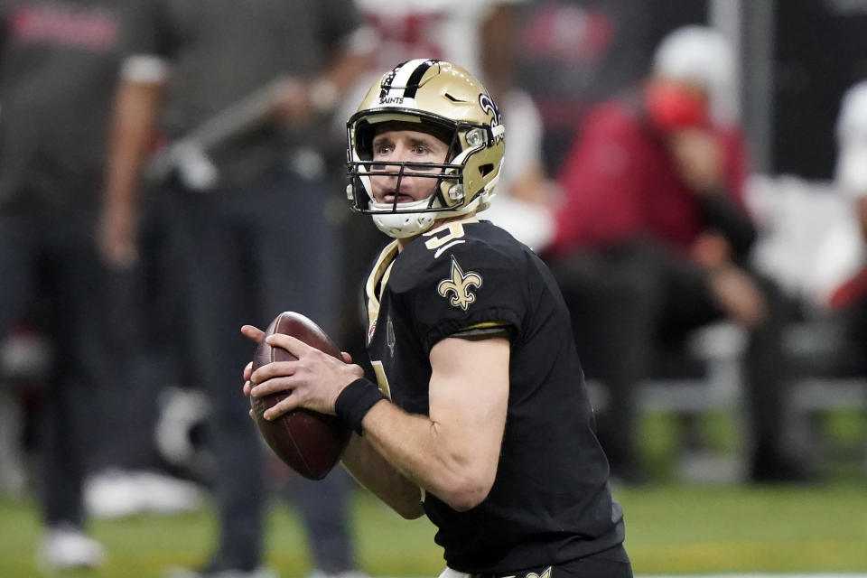 New Orleans Saints quarterback Drew Brees (9) works against the Tampa Bay Buccaneers during the first half of an NFL divisional round playoff football game, Sunday, Jan. 17, 2021, in New Orleans. (AP Photo/Brynn Anderson)