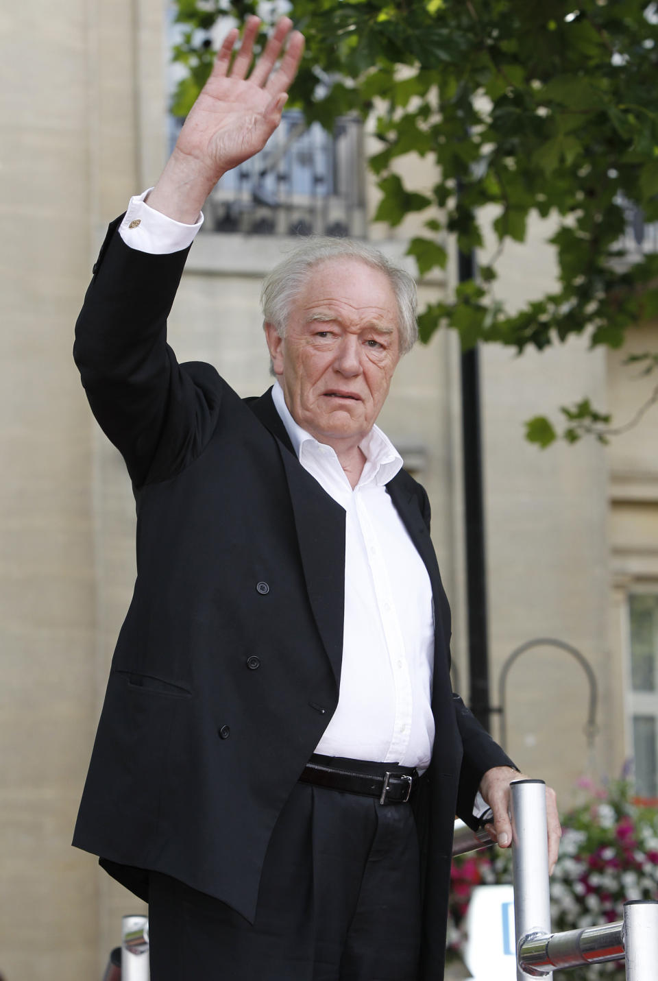 FILE - Actor Michael Gambon arrives in Trafalgar Square, in central London, for the World Premiere of Harry Potter and The Deathly Hallows: Part 2, the last film in the series, Thursday, July 7, 2011. Actor Michael Gambon, who played Dumbledore in the later Harry Potter films, has died at age 82, his publicist says. (AP Photo/Joel Ryan, File)