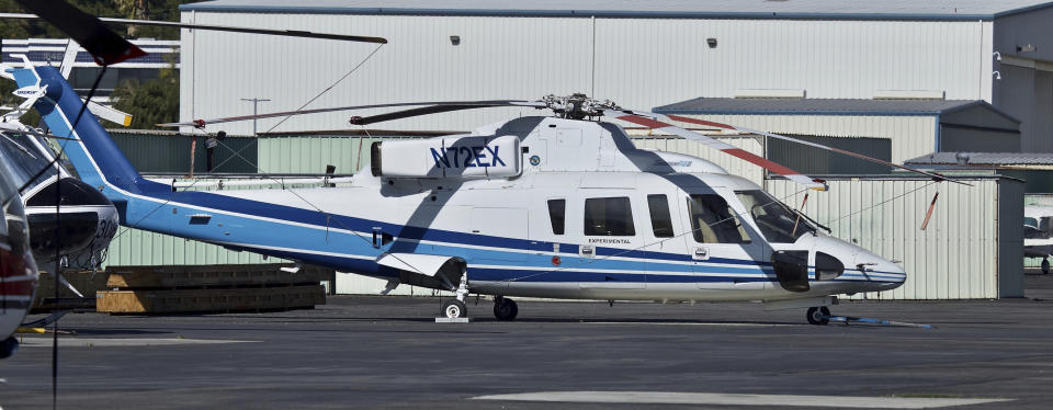 FILE - In this Feb. 1, 2018, file photo shows a Sikorsky S-76B helicopter (N72EX) at Van Nuys Airport in Van Nuys, Calif. NBA legend Kobe Bryant, his 13-year-old daughter and several others were riding in the helicopter when it crashed Jan. 26, 2020, in Calabasas, Calif. Federal safety officials are expected to vote Tuesday, Feb. 9, 2021, on what likely caused the helicopter carrying Kobe Bryant, his 13-year-old daughter and seven others to crash into a Southern California hillside last year, killing all aboard. (AP Photo/Matt Hartman, File)