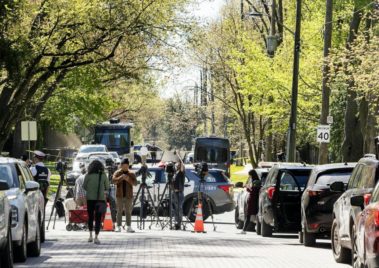 Canadian police and television reporters gather outside the rapper Drake's Toronto mansion after a shooting there in May 2024. <a href="https://www.gettyimages.com/detail/news-photo/may-7-media-are-seen-outside-canadian-entertainer-aubrey-news-photo/2151362963?adppopup=true" rel="nofollow noopener" target="_blank" data-ylk="slk:(Andrew Francis Wallace/Toronto Star via Getty Images;elm:context_link;itc:0;sec:content-canvas" class="link ">(Andrew Francis Wallace/Toronto Star via Getty Images</a>