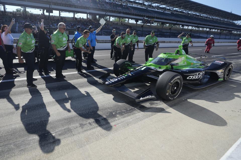 The crew for Rinus VeeKay, of The Netherlands, cheers for VeeKay as he pulls into the pits during qualifications for the Indianapolis 500 auto race at Indianapolis Motor Speedway, Saturday, May 18, 2024, in Indianapolis. (AP Photo/Darron Cummings)