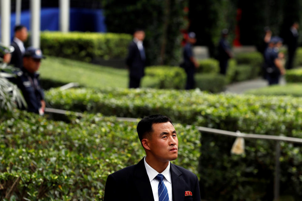 <p>A member of the North Korean security personnel waits for the arrival of North Korea’s leader Kim Jong Un outside St Regis hotel, ahead of the summit between the North Korean leader and President Donald Trump, in Singapore, June 10, 2018. (Photo: Tyrone Siu/Reuters) </p>