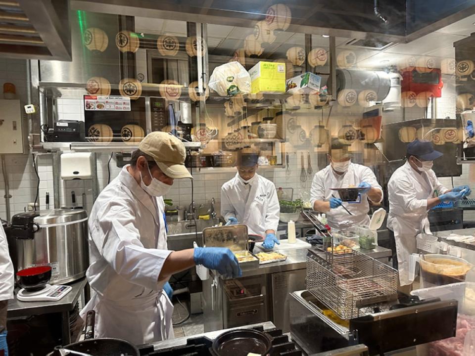 Peek into the kitchen as they get busy cooking your meal