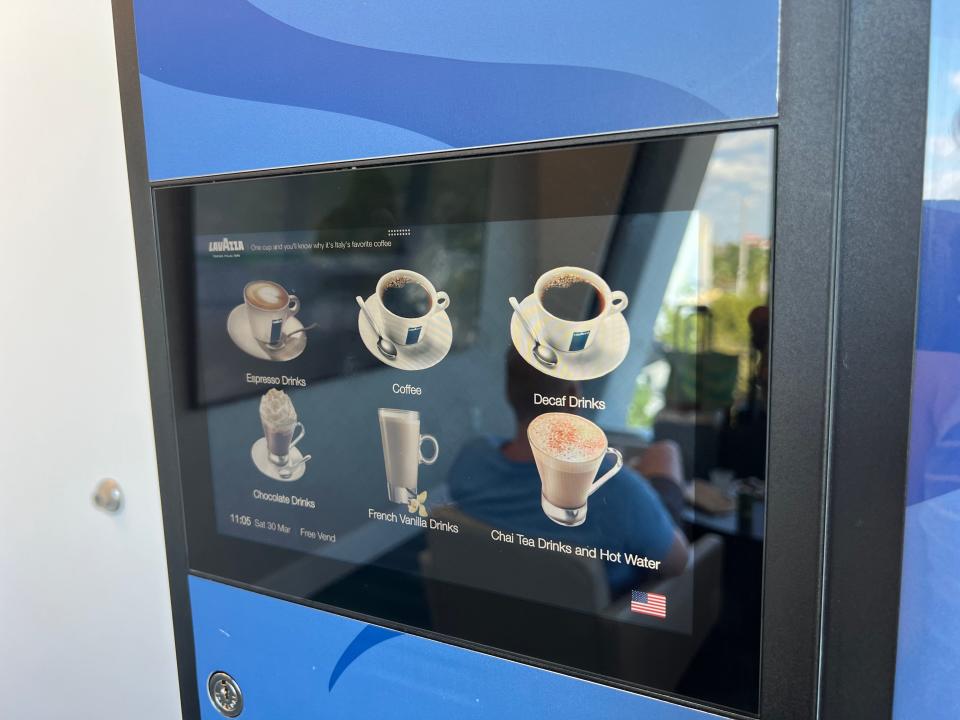 A coffee machine displays options digitally.