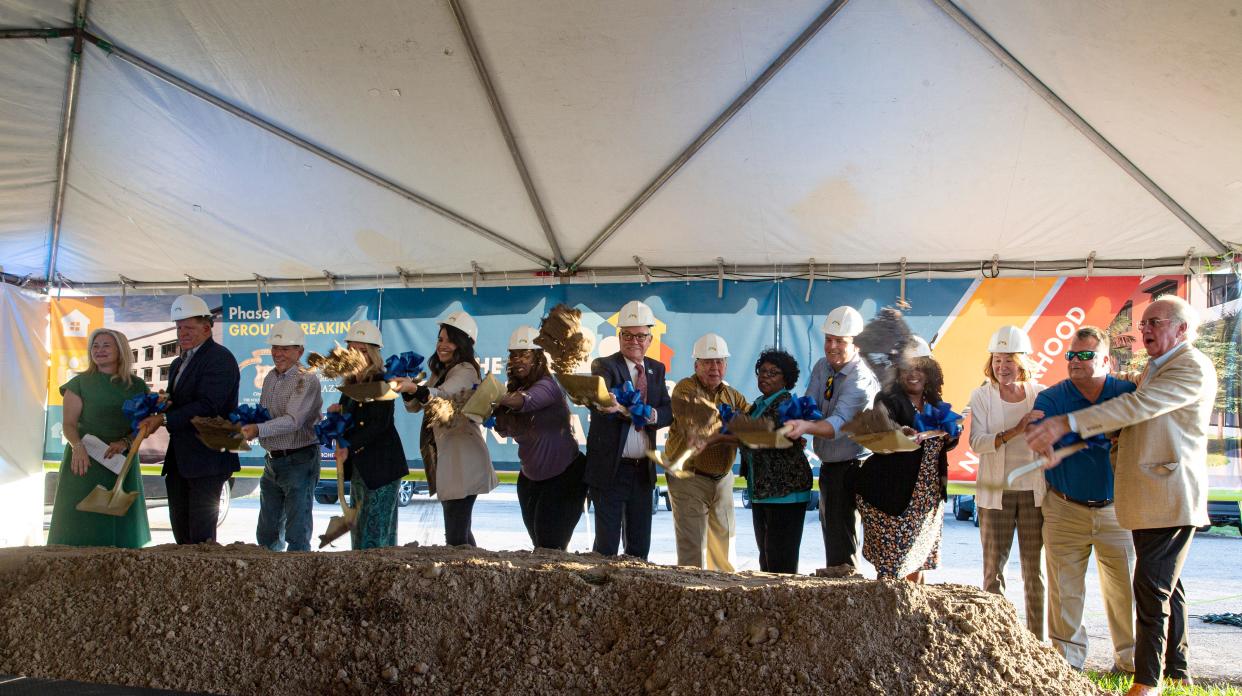 Community leaders and officials participate at a groundbreaking for the first phase of revitalization plan within the greater Dunbar community. The plan is to rebuild new housing at Southward Village. The groundbreaking ceremony was held in a parking area on U.S. 41 several miles from Southward Village.  