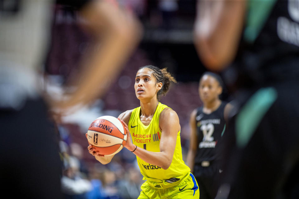 Diggins-Smith during a WNBA preseason game in 2018; she later said she played the whole season pregnant | Tim Clayton—Corbis/Getty Images