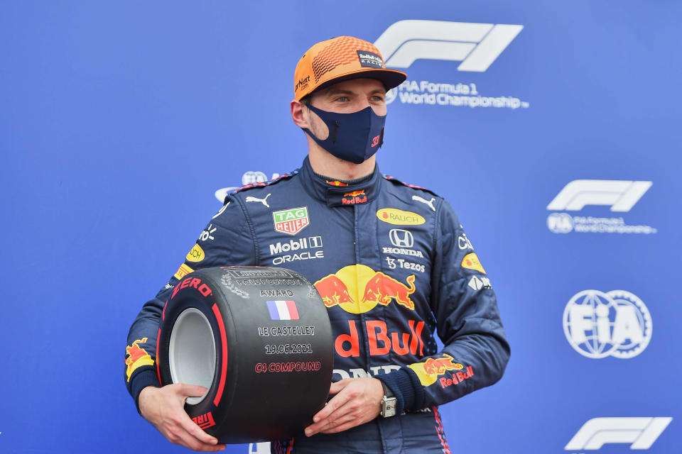 Red Bull driver Max Verstappen of the Netherlands poses after he clocked the fastest time during the qualifying session ahead of the French Formula One Grand Prix at the Paul Ricard racetrack in Le Castellet, southern France, Saturday, June 19, 2021. The French Grand Prix will be held on Sunday. (Nicolas Tucat/Pool via AP)