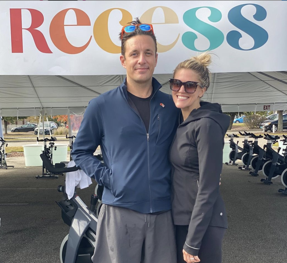 William Friend with his wife, Bevin Prince, on the opening day of Recess by Bevin Prince, a new open-air cycling studio at Mayfaire Town Center.