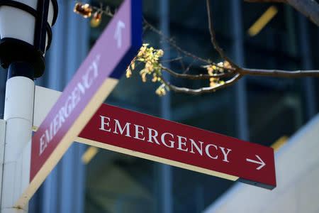 A sidewalk sign points to the emergency entrance at the University of San Diego Health System in La Jolla, California, U.S., March 23, 2017. REUTERS/Mike Blake