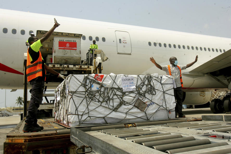 A shipment of COVID-19 vaccines distributed by the COVAX Facility arrives in Abidjan, Ivory Coast, Friday Feb. 25, 2021. Ivory Coast is the second country in the world after Ghana to receive vaccines acquired through the United Nations-backed COVAX initiative with a delivery of 504,000 doses of the AstraZeneca vaccine made by the Serum Institute of India. (AP Photo/ Diomande Ble Blonde)