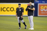 New York Yankees right fielder Joey Gallo, right, talks with Brett Gardner, left, before the team's baseball game against the Miami Marlins, Friday, July 30, 2021, in Miami. Gallo was acquired from the Texas Rangers in a trade. (AP Photo/Lynne Sladky)