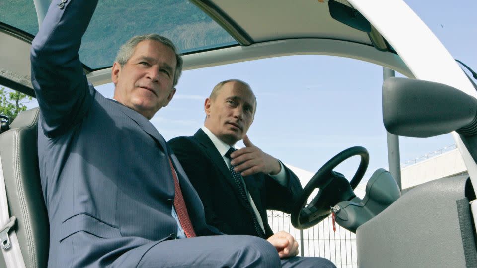 Russian President Vladimir Putin drives US President George W. Bush to a joint news conference during the G8 summit in 2006, held in St. Petersburg. - Handout/Getty Images