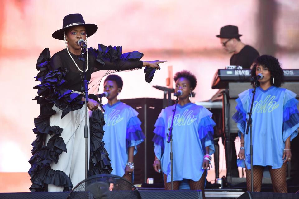 Lauryn Hill performs at Glastonbury in Roberts-Wood’s hand-made, hand-linked, non-stitch black ruffle dress.