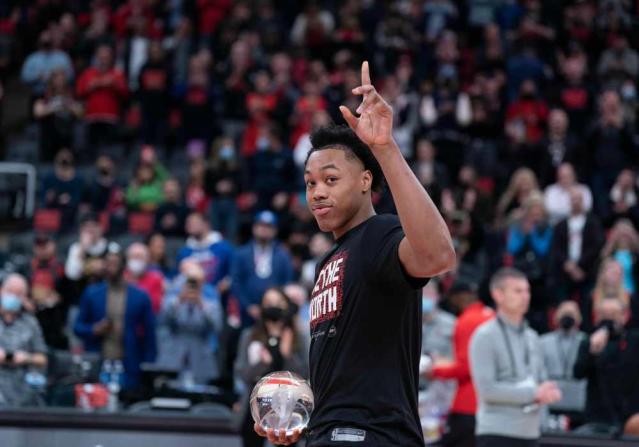 Ja Morant dapped up Kenneth Lofton Jr. after draining a 3-pointer