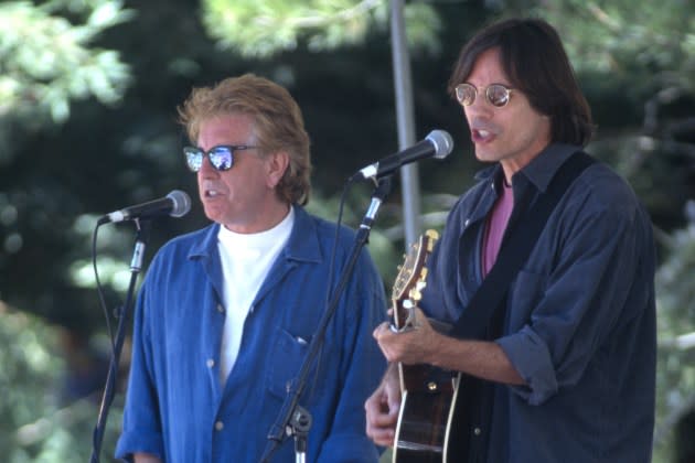Graham Nash and Jackson Browne perform during a No Nukes concert to commemorate the Hiroshima bombing at San Lorenzo park on August 5, 1995 in Santa Cruz, California. - Credit: Tim Mosenfelder/Getty Images