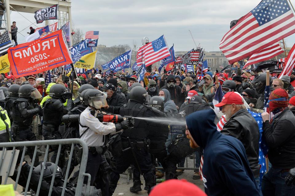 Trump supporters confront police and security forces as they try to storm the Capitol