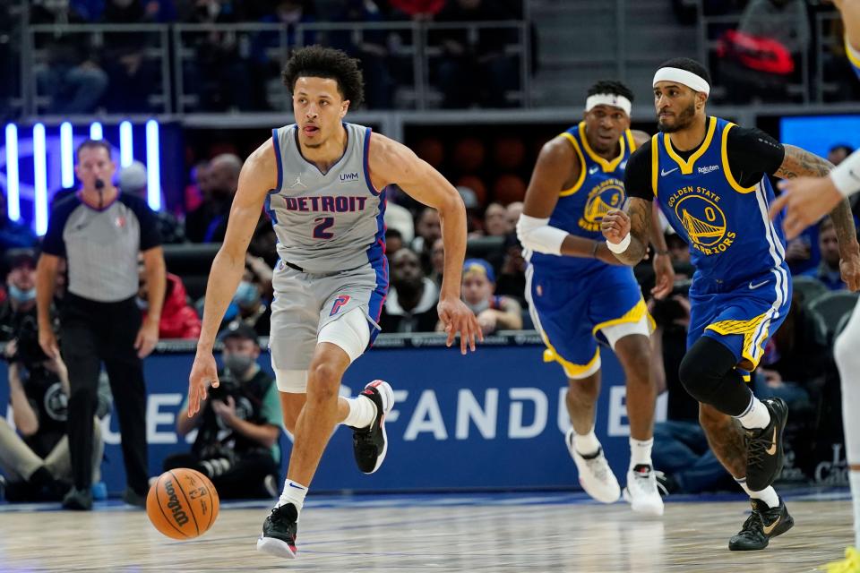 Detroit Pistons guard Cade Cunningham (2) brings the ball up court during against the Golden State Warriors, Friday, Nov. 19, 2021, in Detroit.