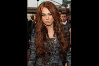 <b>January 2010</b> <br>Red mermaid-long hair with brown tones brightens Miley’s skin color.