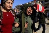 <p>Syrian Kurds mourn during a funeral in the town of Afrin on Jan. 29, 2018, of civilians and fighters from the Syrian Kurdish People’s Protection Units (YPG) who were killed in battles in Syria’s border region of Afrin as the Turkish army press an offensive against Kurdish militia in the area. (Photo: Delil Souleiman/AFP/Getty Images) </p>