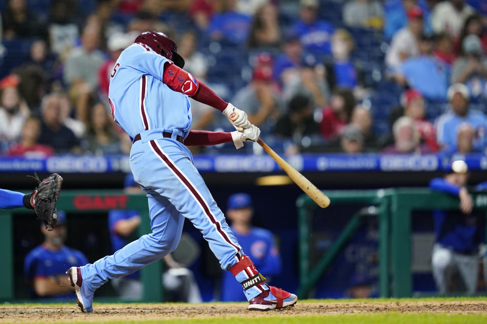 Philadelphia Phillies' Didi Gregorius hits a two-run single against Chicago Cubs pitcher Manuel Rodriguez during the sixth inning of a baseball game, Thursday, Sept. 16, 2021, in Philadelphia. (AP Photo/Matt Slocum)