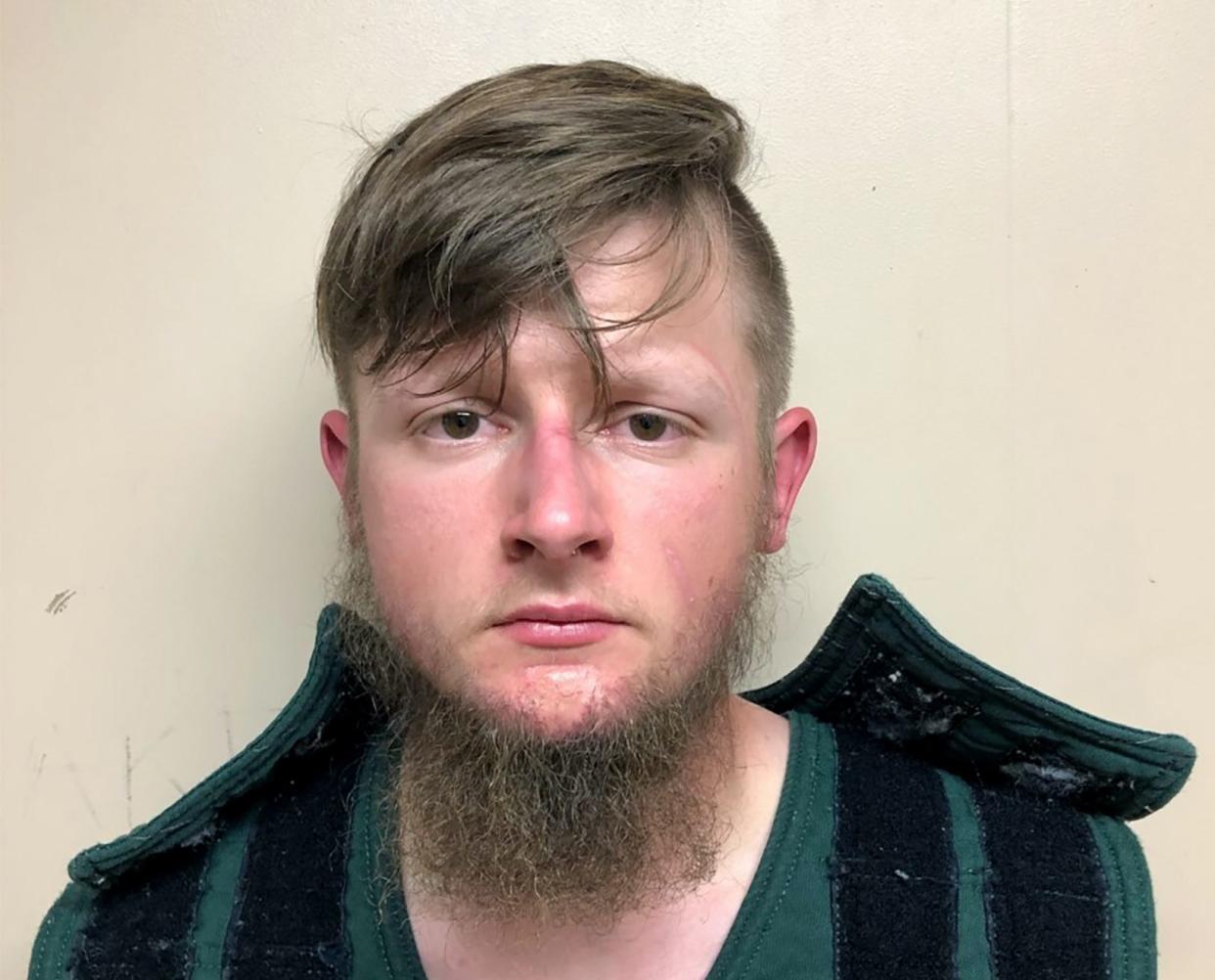 This March 16, 2021 booking photo provided by the Crisp County, Ga., Sheriff's Office shows Robert Aaron Long, 22, accused of killing eight people, six of them women of Asian descent, in shootings at three Atlanta-area massage businesses.