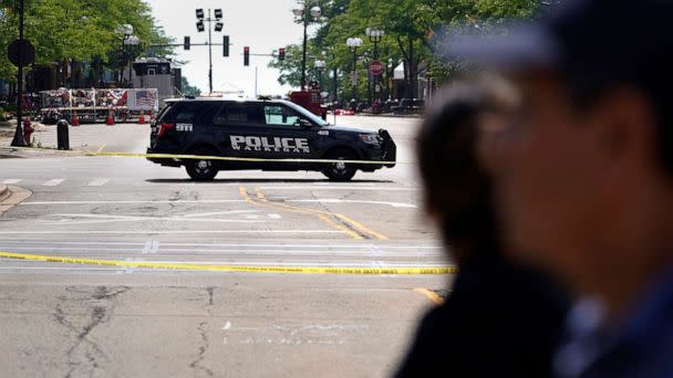 PHOTO: A police vehicle blocks the road on Central avenue where multiple people were killed during Fourth of July celebrations, July 7, 2022, in Highland Park, Ill. (Nam Y. Huh/AP)