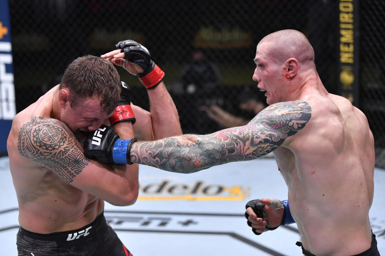 LAS VEGAS, NEVADA - DECEMBER 05: (R-L) Marvin Vettori of Italy punches Jack Hermansson of Sweden in a middleweight bout during the UFC Fight Night event at UFC APEX on December 05, 2020 in Las Vegas, Nevada. (Photo by Chris Unger/Zuffa LLC)