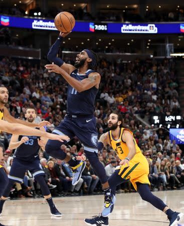 Oct 22, 2018; Salt Lake City, UT, USA; Memphis Grizzlies guard Mike Conley (11) gets past Utah Jazz guard Ricky Rubio (3) and shoots the ball during the second quarter at Vivint Smart Home Arena. Mandatory Credit: Chris Nicoll-USA TODAY Sports