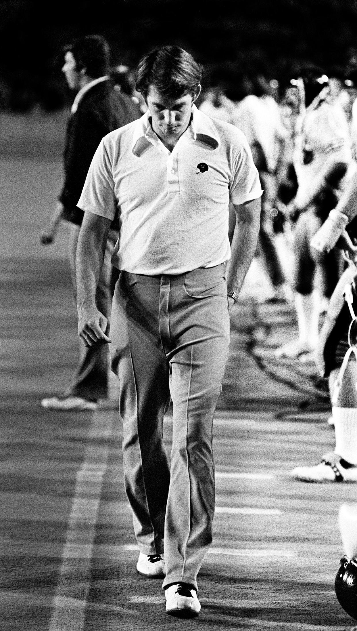 Vanderbilt coach Steve Sloan walks a dejected path along the sidelines as he team is taking a beating at the hands of Alabama on Sept. 29, 1973. The fifth-ranked Crimson Tide defeated Vanderbilt 44-0 before 34,000 at Dudley Field.