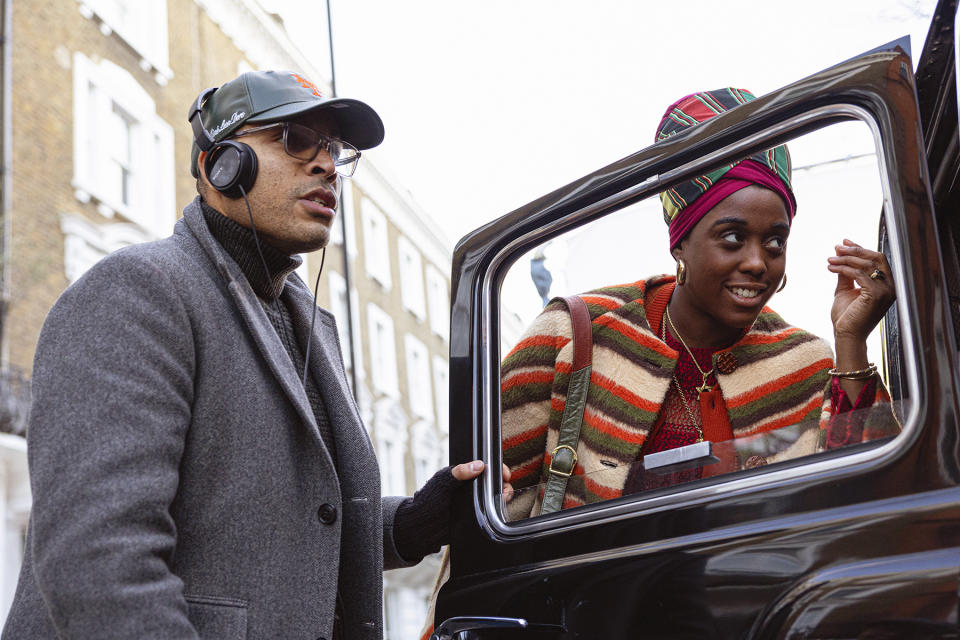 This image released by Paramount Pictures shows director Reinaldo Marcus Green, left, and Lashana Lynch on the set of "Bob Marley: One Love." (Chiabella James/Paramount Pictures via AP)