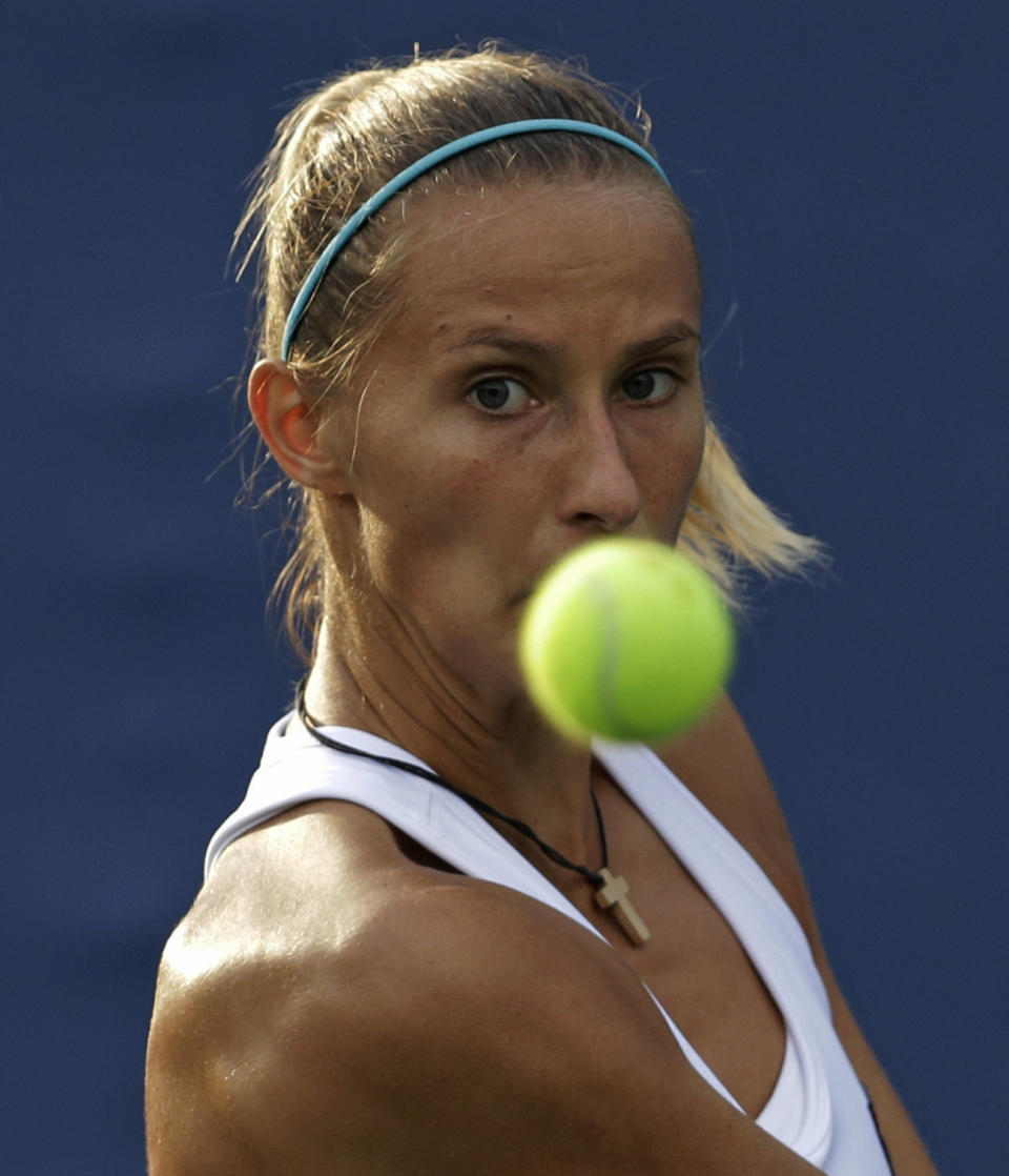 Slovenia's Polona Hercog returns a shot to Ekaterina Makarova, of Russia, during the first round of the 2013 U.S. Open tennis tournament, Monday, Aug. 26, 2013, in New York. (AP Photo/Darron Cummings)