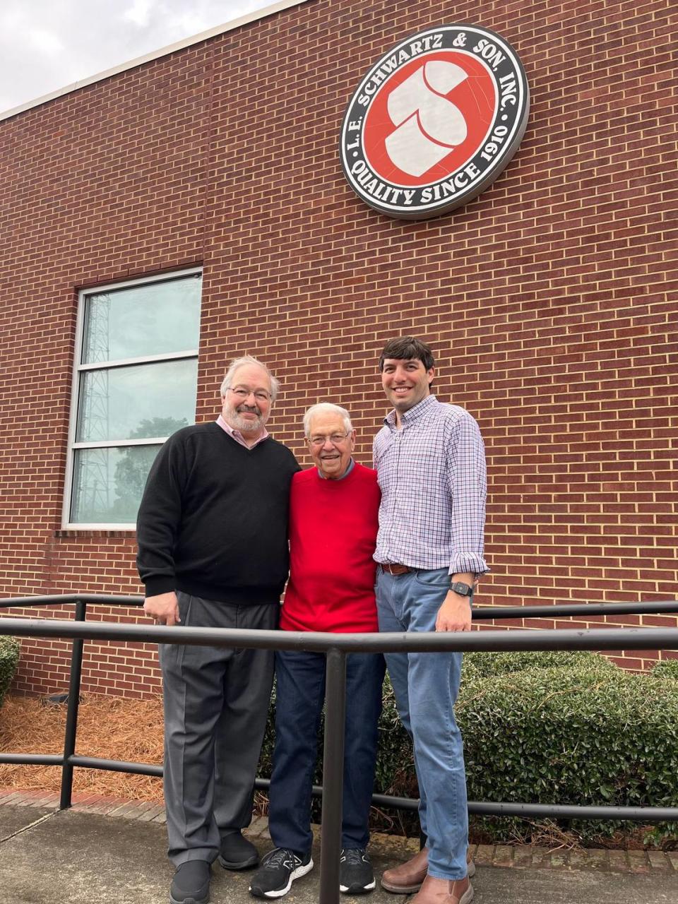 (From left) Steve Kruger, Melvin Kruger, and Michael Kruger smile for a photo in front of their family business L.E. Schwartz. The business has been a Macon staple since 1910. Courtesy Michael Kruger