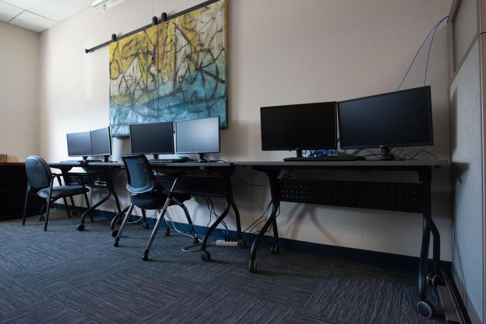 A row of new computer stations are in the midst of preparation Thursday morning as the Kansas Suicide Prevention Headquarters begins its expansion into the 988 program.