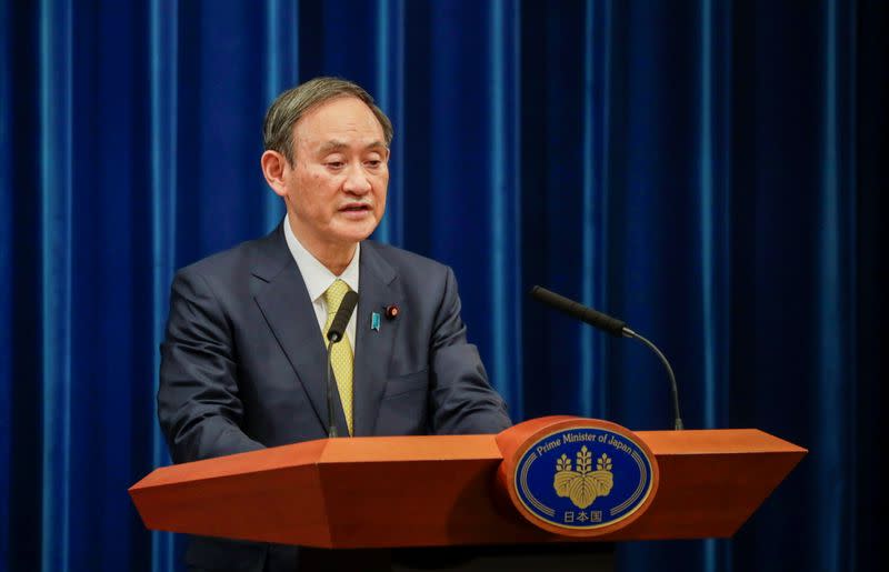 Japanese Prime Minister Yoshihide Suga speaks during a news conference in Tokyo