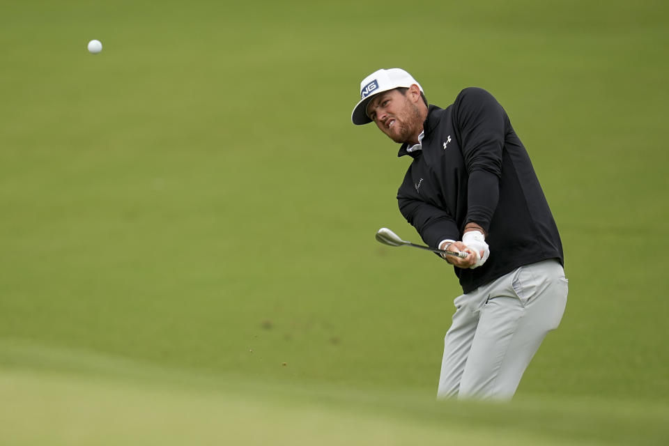 Mito Pereira, of Chile, chips to the green on the fourth hole during the third round of the PGA Championship golf tournament at Southern Hills Country Club, Saturday, May 21, 2022, in Tulsa, Okla. (AP Photo/Sue Ogrocki)