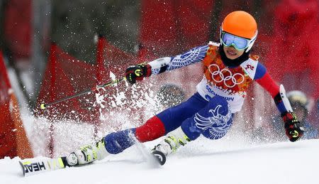 Vanessa Mae, competing for Thailand under her father's name Vanakorn, skis during the first run of the women's alpine skiing giant slalom event at the 2014 Sochi Winter Olympics at the Rosa Khutor Alpine Center, in this file picture taken February 18, 2014. REUTERS/Stefano Rellandini