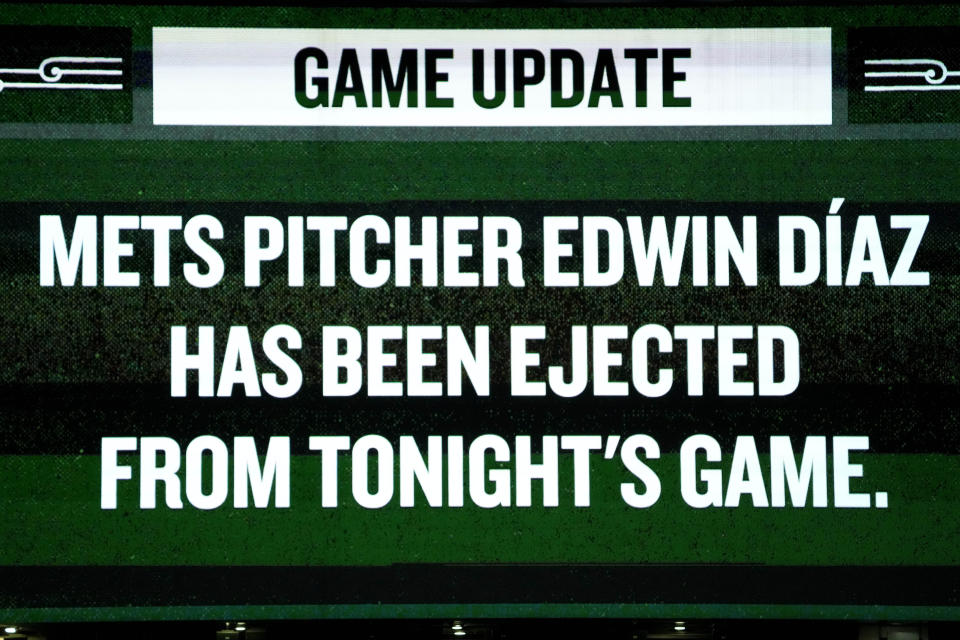 The information screen displays a message that New York Mets relief pitcher Edwin Díaz was ejected during the ninth inning of a baseball game against the Chicago Cubs in Chicago, Sunday, June 23, 2024. (AP Photo/Nam Y. Huh)