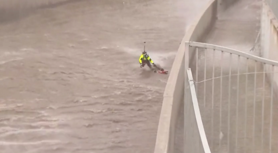 Firefighters rescue woman from storm-flooded L.A. River