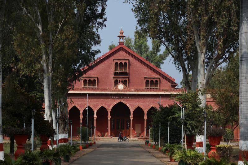 Men ride a motorbike inside the premises of Aligarh Muslim University (AMU) in Aligarh