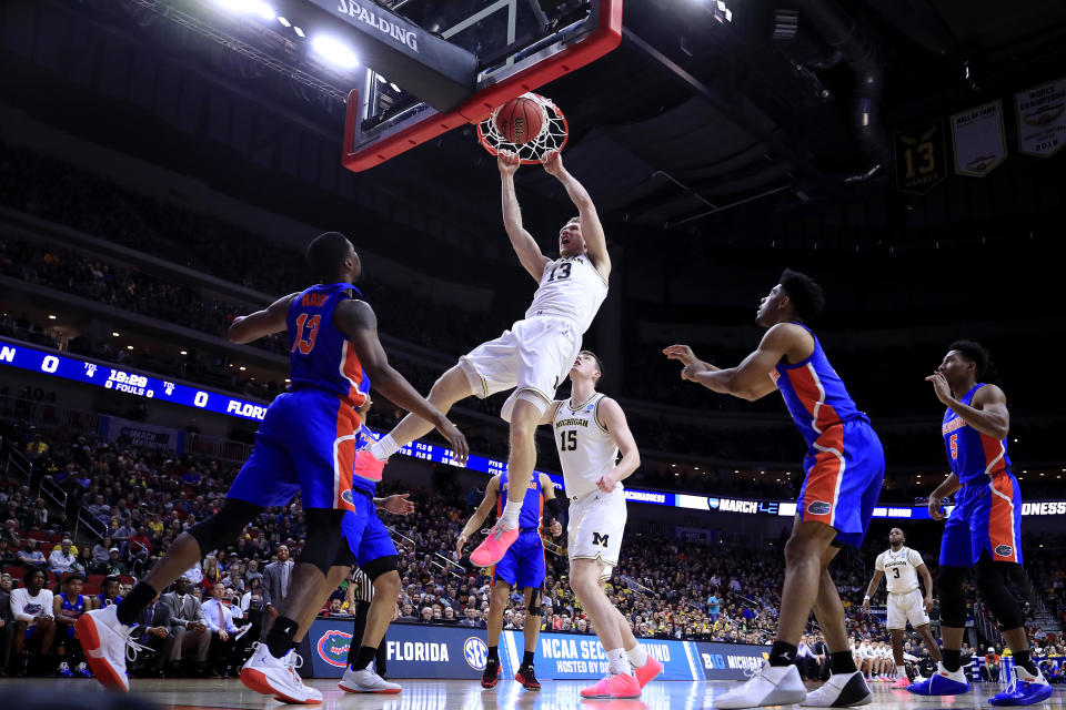 <p>Ignas Brazdeikis #13 of the Michigan Wolverines dunks the ball against the Florida Gators during the first half in the second round game of the 2019 NCAA Men’s Basketball Tournament at Wells Fargo Arena on March 23, 2019 in Des Moines, Iowa. (Photo by Andy Lyons/Getty Images) </p>