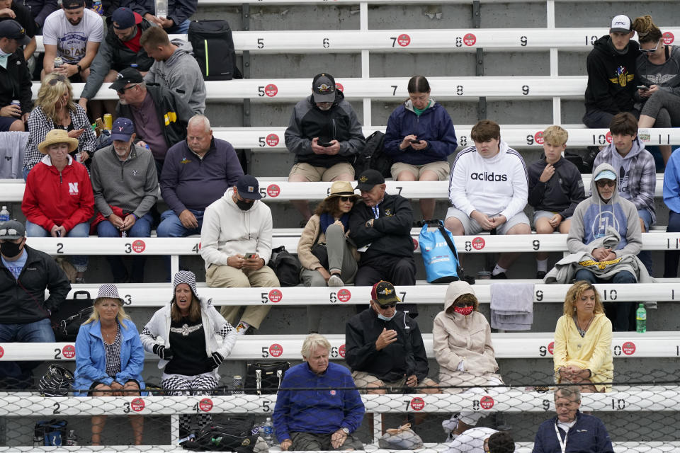 Fans watch during the final practice session for the Indianapolis 500 auto race at Indianapolis Motor Speedway, Friday, May 28, 2021, in Indianapolis. (AP Photo/Darron Cummings)