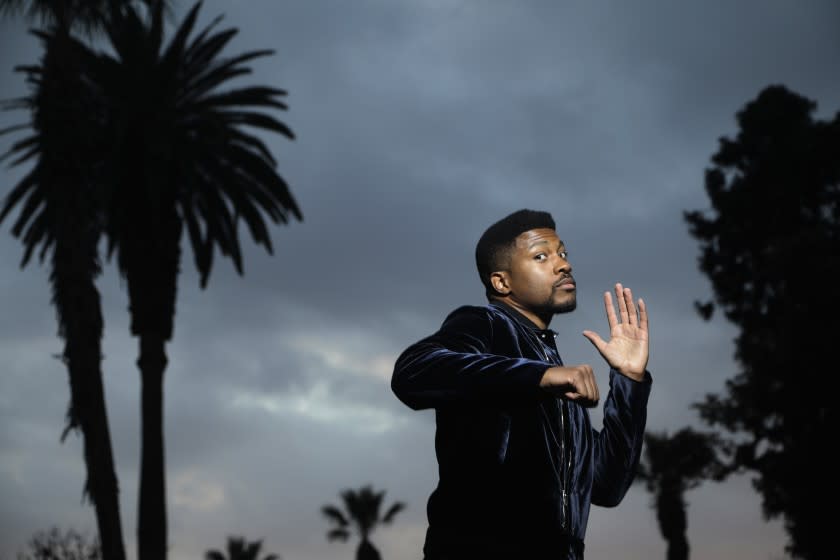 PASADENA, CA - DECEMBER 10: Actor Eli Goree stars as Cassius Clay in "One Night in Miami," in which he decides to convert to Islam and change his name to Muhammad Ali. Photographed at Memorial Park on Thursday, Dec. 10, 2020 in Pasadena, CA. (Myung J. Chun / Los Angeles Times)