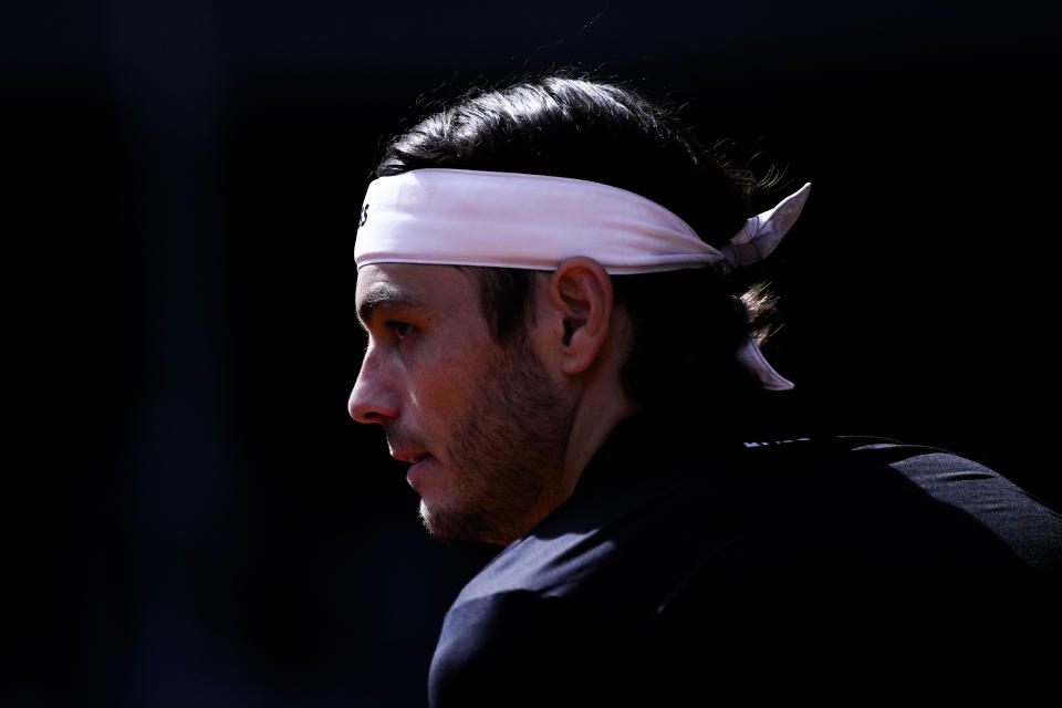 Taylor Fritz, of United States, competes against Andrey Rublev, of Russia, during the Mutua Madrid Open tennis tournament in Madrid, Spain, Friday, May 3, 2024. (AP Photo/Bernat Armangue)