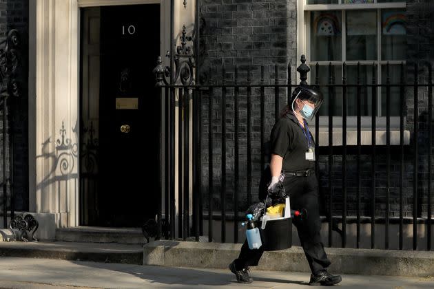 A cleaner wearing face mask leaves 10 Downing Street on April 16, 2020. (Photo: Xinhua News Agency via Getty Images)