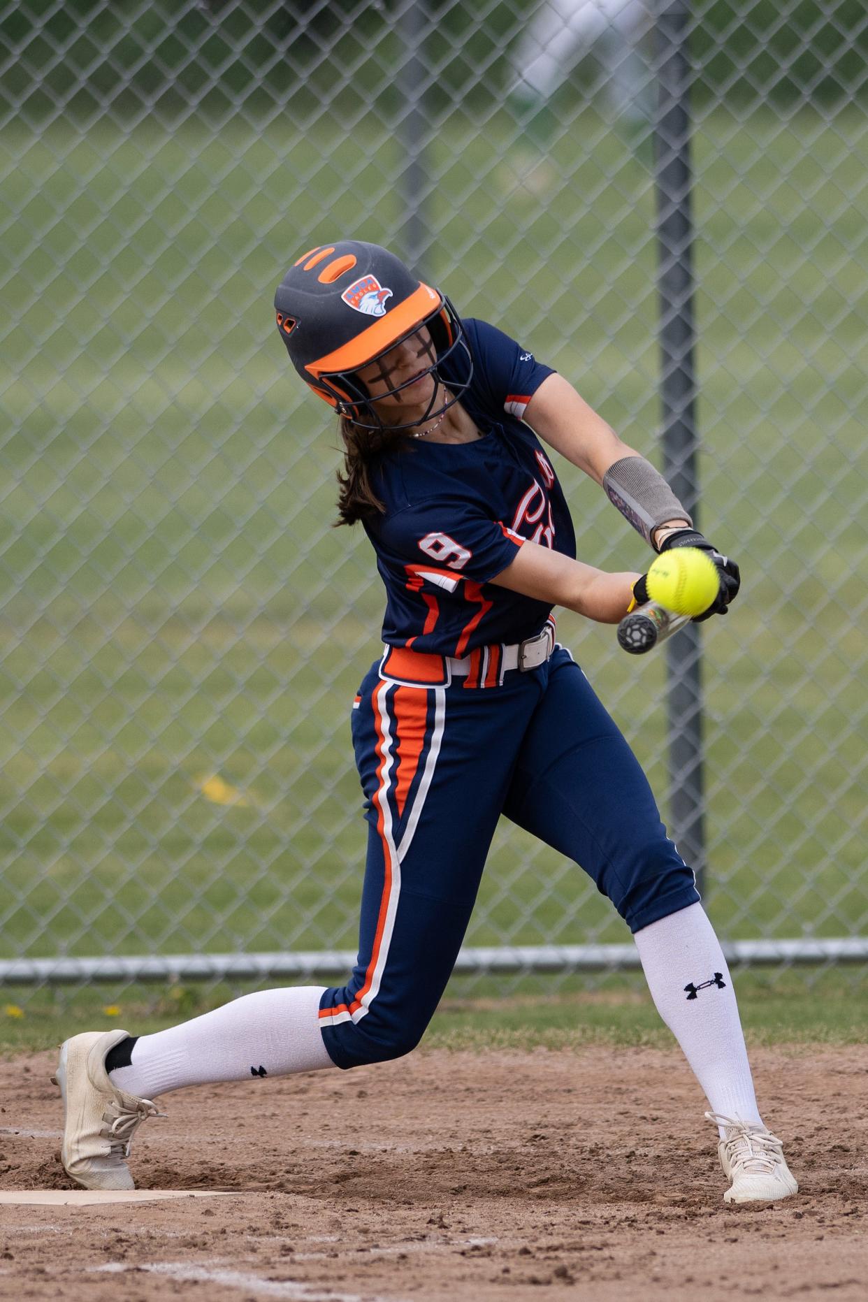 AMSA's Guilamina Yost connects on a pitch against Clinton.