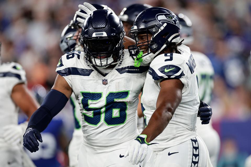 Seahawks running back Kenneth Walker III celebrates with linebacker Jordyn Brooks (56) after scoring in Seattle's Oct. 2 win over the New York Giants. The Seahawks return home Sunday to host the 1-5 Arizona Cardinals.